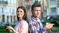 Photographers standing back to back on street and looking at camera, hobby Royalty Free Stock Photo