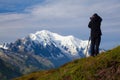 Photographers stay on mountain. Dreamy mountains, orange sunrise in a beautiful valley. Colorful summer view of the Lac Blanc lake Royalty Free Stock Photo