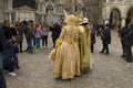 Photographers take pictures of a couple in the carnival costumes in Venice