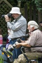 Photographers taking pictures at event.