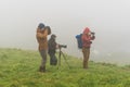 Photographers are waiting for the right shot on Mikines, Faroe I