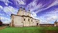 Photographic art picture of famous Goritsky orthodox monastery under blue cloudy sky in summer