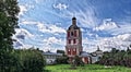 Photographic art picture of orthodox monastery tower under cloudy sky in summer