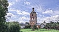 Photographic art picture of orthodox monastery tower under cloudy sky in summer
