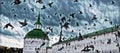 Photographic art picture of pigeon flock moving against Russian orthodox church under dramatic cloudy sky