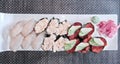 Photographic art picture of various types of sushi pieces with caviar, molusks on white plate with green wasabi and red colored Royalty Free Stock Photo