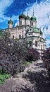 Photographic art picture of way to church concept: footpath to famous Goritsky orthodox monastery under blue cloudy sky in summer