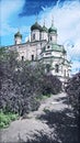 Photographic art picture of way to church concept: footpath to famous Goritsky orthodox monastery under blue cloudy sky in summer