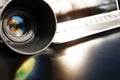 Photographic camera lens with laptop Royalty Free Stock Photo