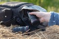 Photographic lens is lying on a haystack, countryside protographer concept