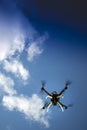 Drone in flight with cloudy sky Royalty Free Stock Photo