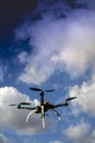 Drone in flight with cloudy sky Royalty Free Stock Photo
