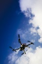Drone in flight with cloudy sky Royalty Free Stock Photo