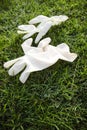 Disposable anti Coronavirus gloves thrown on the ground