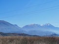 Photographic shot of the Albanian landscape in the countryside facing a Snowy mountain