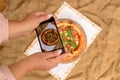 Photographing Food. Hands Taking Picture Of Delicious Pizza With Smartphone.