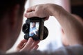 Photographing baby girl or shooting video on digital camera, funny family photo session