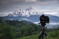 Photographing the sunrise over mountain Watzmann in Berchtesgaden with DSLR camera on tripod, Bavaria