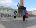 Photographing tourists at the Palace square