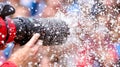 Photographing Water Splashes with Professional Camera Lens at Outdoor Event