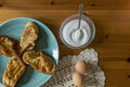 Photography from above of a typical Spanish dessert eaten during easter. Morning shot.Cinnamon,eggs,bread, sugar. Wood background