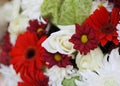 a photography of a bouquet of flowers with red and white flowers, vase of flowers with red and white flowers in the middle