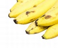 a photography of a bunch of bananas with brown spots on them, there are a bunch of bananas that are on a table