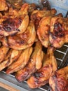 a photography of a bunch of chicken wings on a grill, a close up of a bunch of chicken wings on a grill