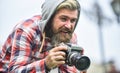 Photography business. Old technology. Bearded man hipster take photo. Brutal stylish man with retro camera. Modern Royalty Free Stock Photo