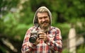 Photography business. Old technology. Journalist reporter. Professional photographer use vintage camera. Bearded man Royalty Free Stock Photo