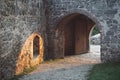 Gate to the historical middle age castle with sunset in the background - stony archway of Kuneticka mountain (Pardubice)