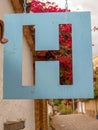 Photography of a hanging metallic hotel signal