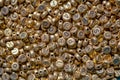 Photography of a heap of golden letter beads