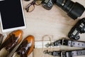 Photography hipster work table set with tablet, film, vintage shoes, lenses, supplies and digital film cameras. Top view with copy Royalty Free Stock Photo