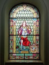 Photography of a leaded glass with image representing justice