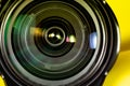 Photography lens aperture on a yellow background. Photo vision concept Royalty Free Stock Photo