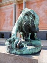 Lion fighting snake statuette