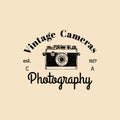 Photography logo. Vector vintage old camera label, badge, emblem. Hand sketched illustration for studio, store etc. Royalty Free Stock Photo