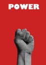 Photography of male fist rising up isolated on red background with word power above it Royalty Free Stock Photo