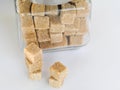 Brown cane sugar cubes glass jar Royalty Free Stock Photo