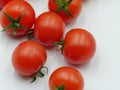 Fresh cherry tomatoes with fresh green vines Royalty Free Stock Photo