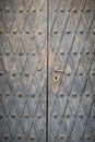 Old metal-decorated church door - detail texture - handle and keyhole Royalty Free Stock Photo