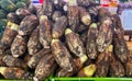 a photography of a pile of bananas and cucumbers in a market, capitulumes piled on top of each other at a market