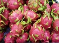 a photography of a pile of dragon fruit sitting on top of a table