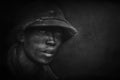 Photography, portrait of a Vietnamese soldier with a military helmet.