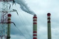 Smoking chimneys of coal power plant - air pollution - dark sky - global warming Royalty Free Stock Photo