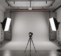 Photography studio setup with a white seamless backdrop and overhead lighting. Royalty Free Stock Photo