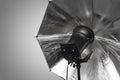 Photography studio strobe flash with silver umbrella