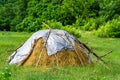 Photography on theme big dry haystack in grass farm field Royalty Free Stock Photo