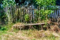 Photography on theme old wooden bench overgrown with grass Royalty Free Stock Photo
